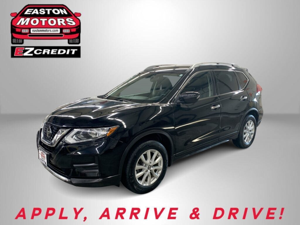 Black SUV in a showroom with an Easton Motors EZ Credit logo on a gray wall; banner text reads 'APPLY, ARRIVE & DRIVE!'