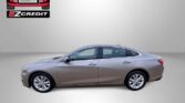 Side view of a gray/brown sedan in a dealership setting with Easton Motors logo and EZCredit text in the top left; slogan 'APPLY, ARRIVE & DRIVE!' at bottom.