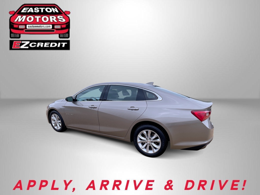 Beige four-door sedan posed in a neutral backdrop with Easton Motors EZCredit logo and the slogan 'APPLY, ARRIVE & DRIVE!'.