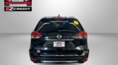 Black Nissan Rogue rear with Easton Motors branding on the rear window and a yellow smiley sticker; banner at bottom reads 'APPLY, ARRIVE & DRIVE!'