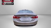 Rear view of a silver Chevrolet Malibu with Easton Motors logo in the top-left and 'APPLY, ARRIVE & DRIVE' in red at the bottom