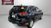 Black Nissan SUV shown from rear-side in a showroom, with Easton Motors branding on the wall and the slogan 'APPLY, ARRIVE & DRIVE!' in red text below.