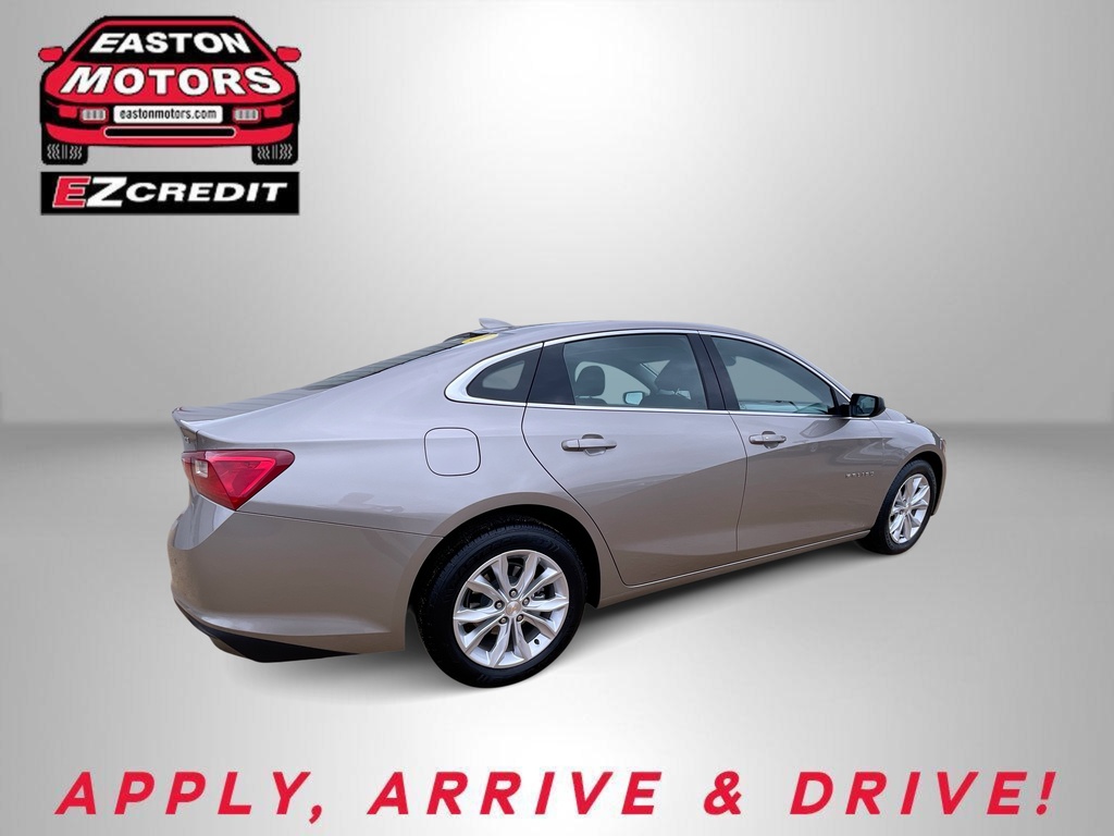 Beige four-door sedan from rear three-quarter view; Easton Motors EZ Credit logo top-left and the slogan 'APPLY, ARRIVE & DRIVE!' bottom.