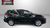 Black SUV photographed in a showroom with an Easton Motors EZCredit logo in the upper left and 'APPLY, ARRIVE & DRIVE!' text at the bottom.