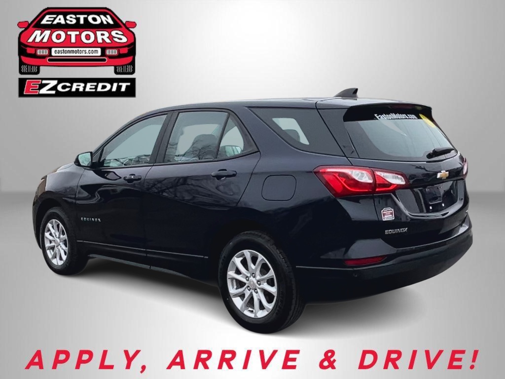 Rear-quarter view of a black Chevrolet Equinox SUV with Easton Motors EZ Credit branding in the corner and a promotional 'Apply, Arrive & Drive!' slogan at the bottom