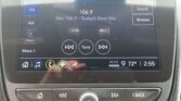 Car radio touchscreen showing FM station 106.9 and 'Today's Best Mix'.