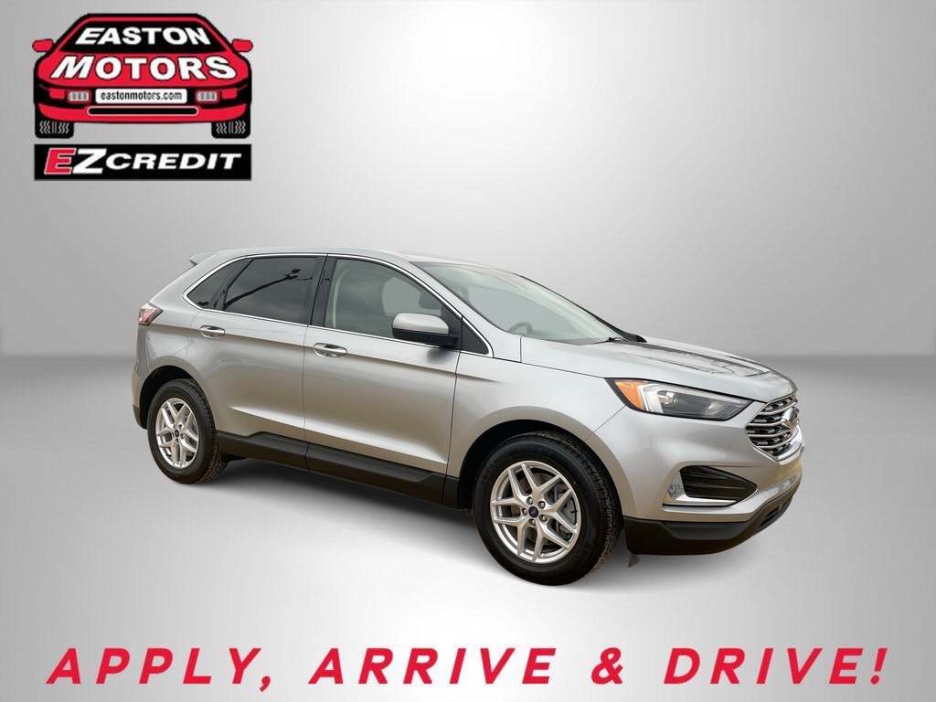 Silver SUV displayed on a neutral backdrop with Easton Motors EZCredit logo; bottom text reads 'APPLY, ARRIVE & DRIVE'.