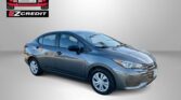 Blue sedan car photographed from side-front, with Easton Motors EZ Credit logo on a gray background and the promo slogan 'APPLY, ARRIVE & DRIVE!'