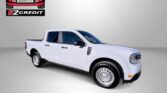 White four-door pickup truck displayed for Easton Motors EZ Credit advertisement with 'APPLY, ARRIVE & DRIVE!' slogan at the bottom.