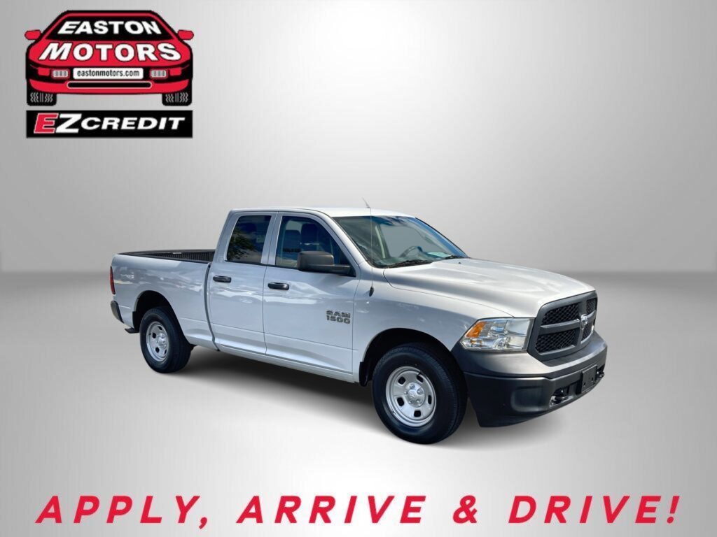 White Ram 1500 pickup against a gray backdrop with Easton Motors EZ Credit logo in the top left corner, advertising sales slogan below.