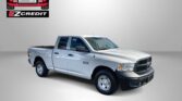 White Ram 1500 pickup against a gray backdrop with Easton Motors EZ Credit logo in the top left corner, advertising sales slogan below.