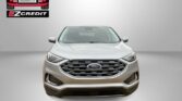 Front view of a silver Ford SUV on a gray backdrop with Easton Motors EZCredit logo in the top-left corner and 'APPLY, ARRIVE & DRIVE!' at the bottom