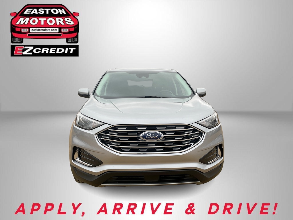 Front view of a silver Ford SUV on a gray backdrop with Easton Motors EZCredit logo in the top-left corner and 'APPLY, ARRIVE & DRIVE!' at the bottom
