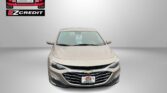 Beige Chevrolet sedan front view with Easton Motors logo in the top-left and 'APPLY, ARRIVE & DRIVE!' slogan across the bottom.