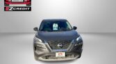 Front view of a gray Nissan SUV with Easton Motors logo in the upper left and 'APPLY, ARRIVE & DRIVE!' text at the bottom, on a gray gradient background.