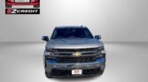 Front view of a silver Chevrolet pickup truck with Easton Motors branding in the top-left corner and 'APPLY, ARRIVE & DRIVE!' slogan at the bottom.