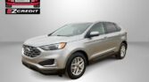 Silver Ford SUV displayed at Easton Motors EZ Credit dealership with bold ‘APPLY, ARRIVE & DRIVE’ slogan in red text bottom left corner.
