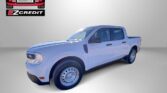 White pickup truck on a dealership backdrop with Easton Motors and EZCredit logos visible; slogan 'APPLY, ARRIVE & DRIVE' shown below.