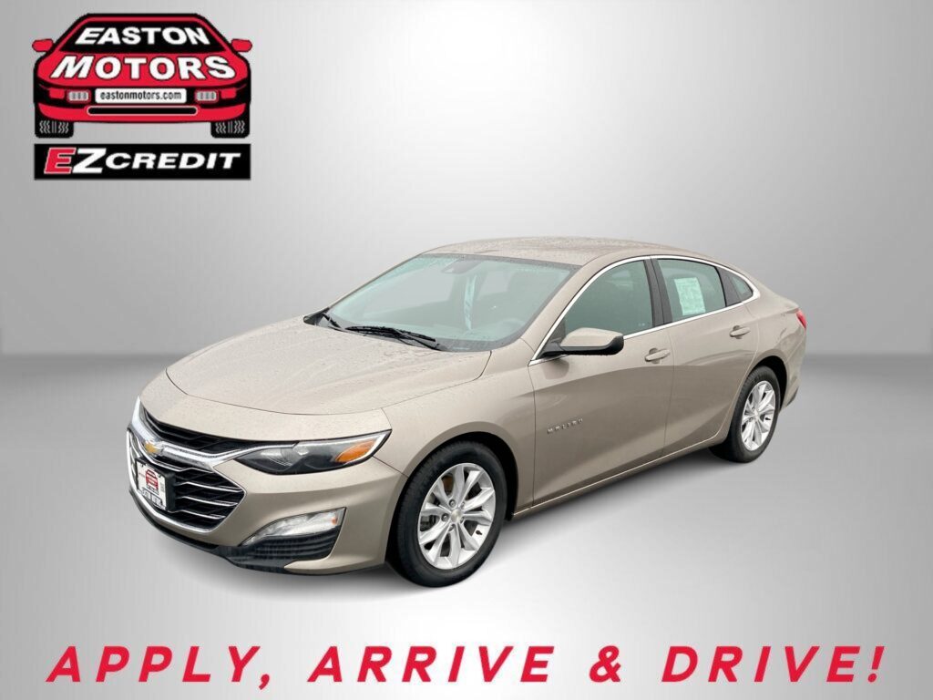 Beige Chevrolet sedan photographed in a studio with Easton Motors logo and the words 'APPLY, ARRIVE & DRIVE!'