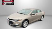 Beige Chevrolet sedan photographed in a studio with Easton Motors logo and the words 'APPLY, ARRIVE & DRIVE!'