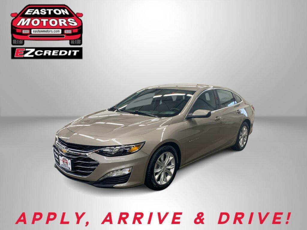 Beige sedan displayed in a studio with the Easton Motors logo in the upper left and 'Apply, Arrive & Drive' slogan below.
