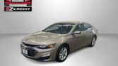 Beige sedan displayed in a studio with the Easton Motors logo in the upper left and 'Apply, Arrive & Drive' slogan below.