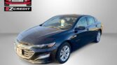 Blue sedan shown at a dealership banner with EZ Credit/ Easton Motors logo in the top left and 'APPLY, ARRIVE & DRIVE!' text at the bottom.