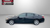 Black Chevrolet Malibu in profile against a gray gradient backdrop, with Easton Motors EZ Credit logo and the slogan 'APPLY, ARRIVE & DRIVE!' at the bottom