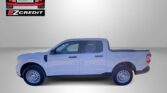 White crew cab pickup truck in a studio setting with Easton Motors and EZ Credit logos; slogan 'APPLY, ARRIVE & DRIVE!' at the bottom