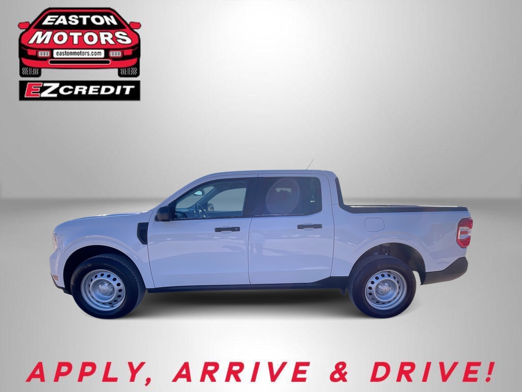 White crew cab pickup truck in a studio setting with Easton Motors and EZ Credit logos; slogan 'APPLY, ARRIVE & DRIVE!' at the bottom