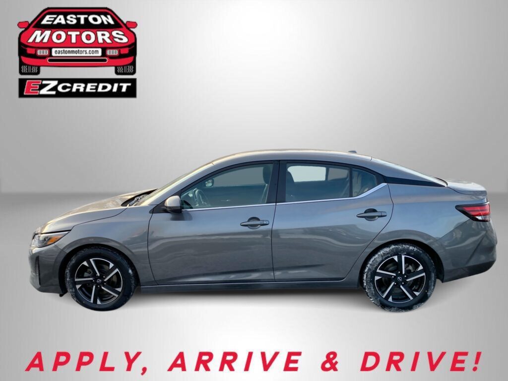 Side view of a gray sedan with EZCredit branding in the top left and the slogan 'APPLY, ARRIVE & DRIVE!' at the bottom.
