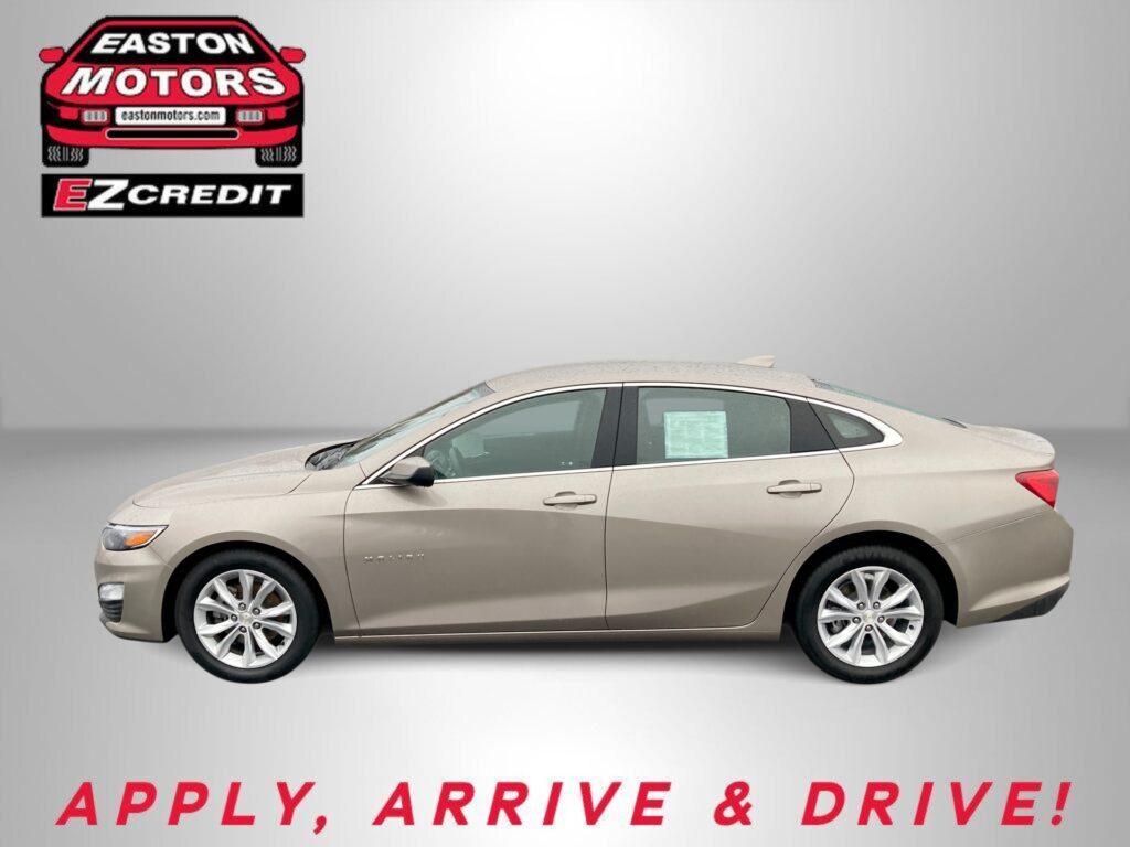 Beige sedan shown against a gray backdrop with the EZCredit logo top-left and the slogan 'APPLY, ARRIVE & DRIVE!' in red at the bottom.