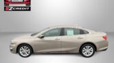 Beige sedan shown against a gray backdrop with the EZCredit logo top-left and the slogan 'APPLY, ARRIVE & DRIVE!' in red at the bottom.