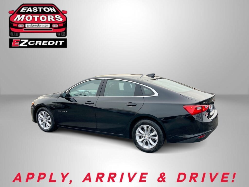 Promotional image with a black Malibu sedan, Easton Motors logo, and EZ Credit branding on a gray gradient background.