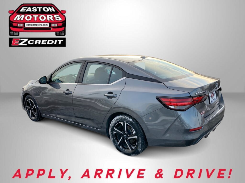 Gray Nissan Sentra shown from rear-side with Easton Motors logo and EZ Credit banner; ad reads 'Apply, Arrive & Drive'