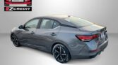 Gray Nissan Sentra shown from rear-side with Easton Motors logo and EZ Credit banner; ad reads 'Apply, Arrive & Drive'