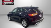 Rear three-quarter view of a black SUV in a studio with Easton Motors EZ Credit logo in the upper left and 'APPLY, ARRIVE & DRIVE!' text at the bottom.