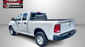 White pickup truck photographed from the back-left on a gray gradient background, with an Easton Motors EZ Credit logo above and the slogan 'APPLY, ARRIVE & DRIVE!' at the bottom.