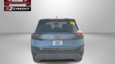 Rear view of a Nissan Rogue with Easton Motors branding on the back window and 'APPLY, ARRIVE & DRIVE!' slogan at the bottom.