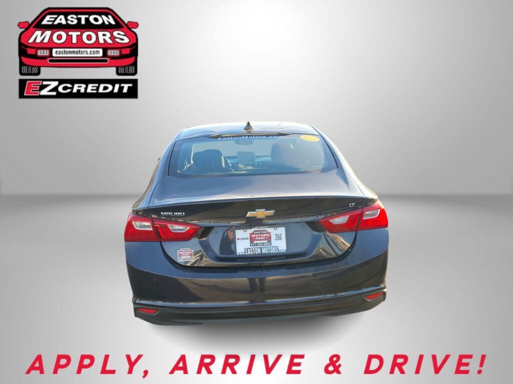 Rear view of a dark Chevrolet sedan with Easton Motors branding on the back, and the slogan 'APPLY, ARRIVE & DRIVE!' shown at the bottom.
