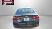 Rear view of a dark Chevrolet sedan with Easton Motors branding on the back, and the slogan 'APPLY, ARRIVE & DRIVE!' shown at the bottom.