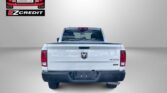 Rear view of a white pickup truck with Easton Motors and EZ Credit logos; red 'APPLY, ARRIVE & DRIVE!' text below.