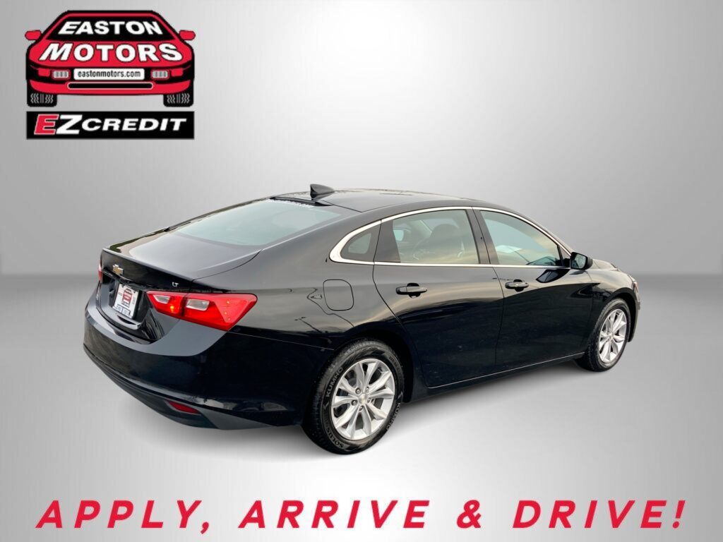 Black sedan shown from the rear with EZ Credit logo in the top-left and 'APPLY, ARRIVE & DRIVE!' text along the bottom edge.