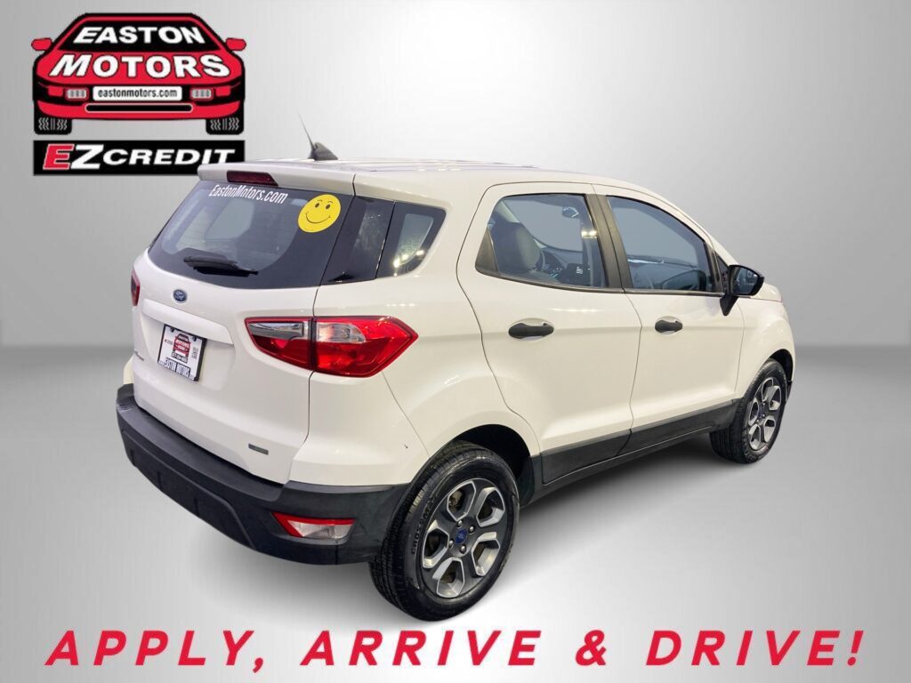 White SUV parked indoors with a large Easton Motors logo on the wall behind it, and the banner text 'APPLY, ARRIVE & DRIVE!' below.