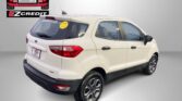 White SUV parked indoors with a large Easton Motors logo on the wall behind it, and the banner text 'APPLY, ARRIVE & DRIVE!' below.