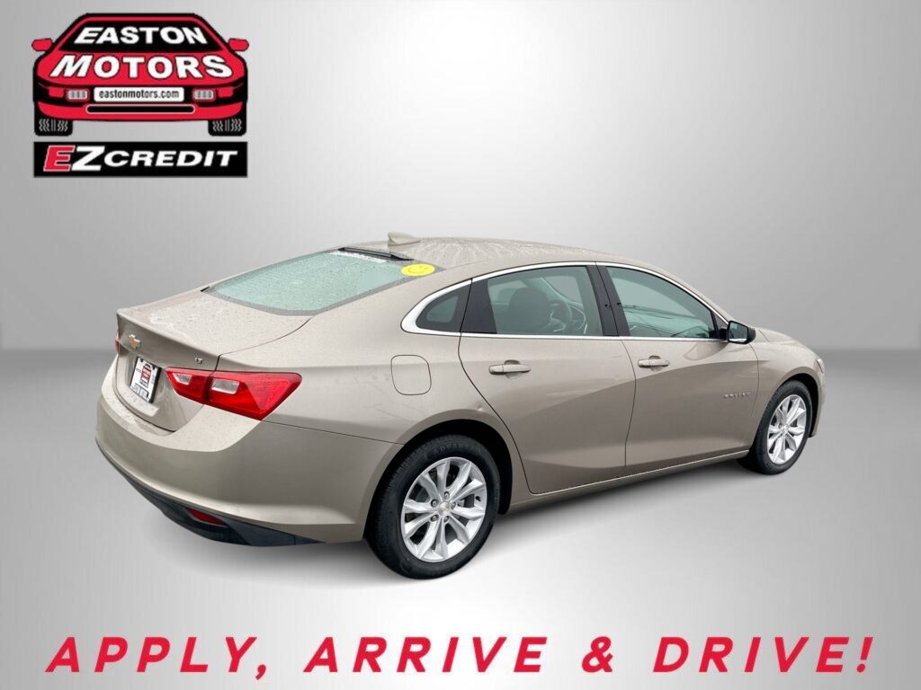 Beige Chevy sedan shown from rear-side with Easton Motors EZ Credit logo in the upper left and the slogan 'APPLY, ARRIVE & DRIVE!' at the bottom.