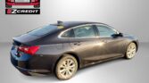 Dark gray sedan shown from a rear-side view with an Easton Motors EZCredit logo in the top left and 'APPLY, ARRIVE & DRIVE!' text along the bottom banner.