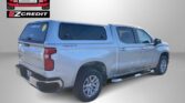 Silver pickup with blue canopy; Easton Motors and EZCredit logos on a gray background.