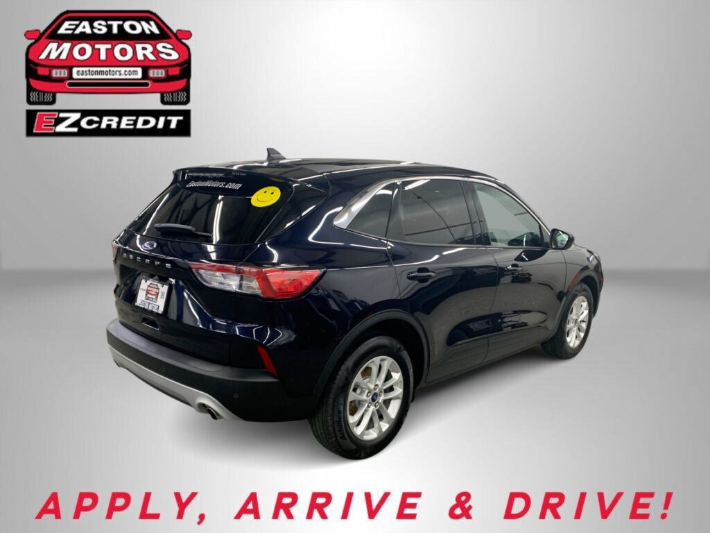 Red car with large Easton Motors logo in top-left, showroom background; dealership promo image.