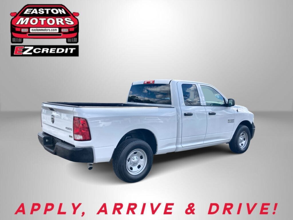 White pickup truck against a gray background with the Easton Motors logo and the slogan "Apply, Arrive & Drive!"
